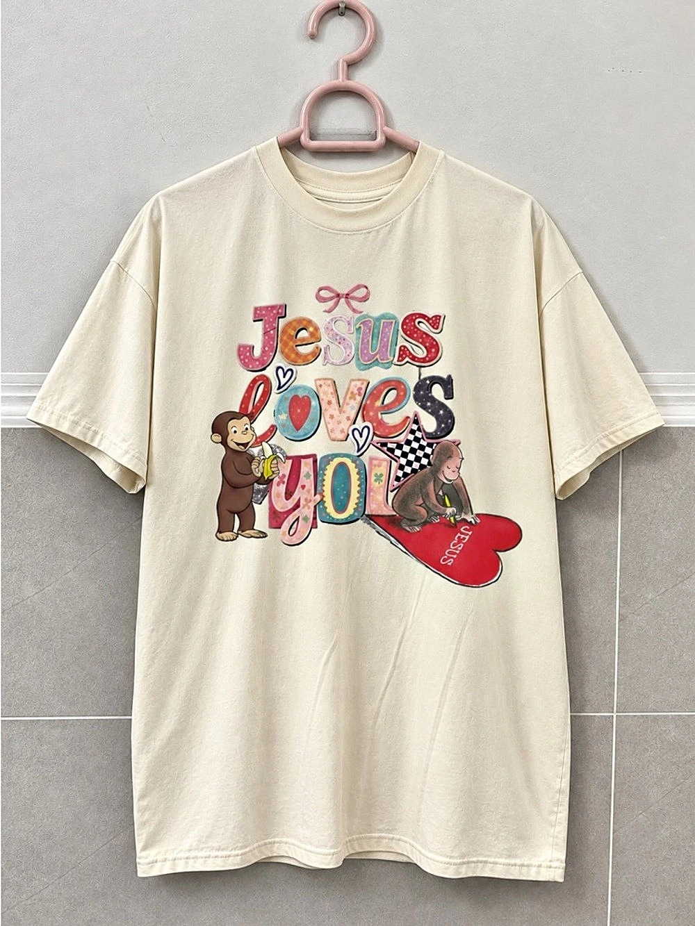Curious Geogre Jesus Loves You Graphic Whimsical OffWhite Tee